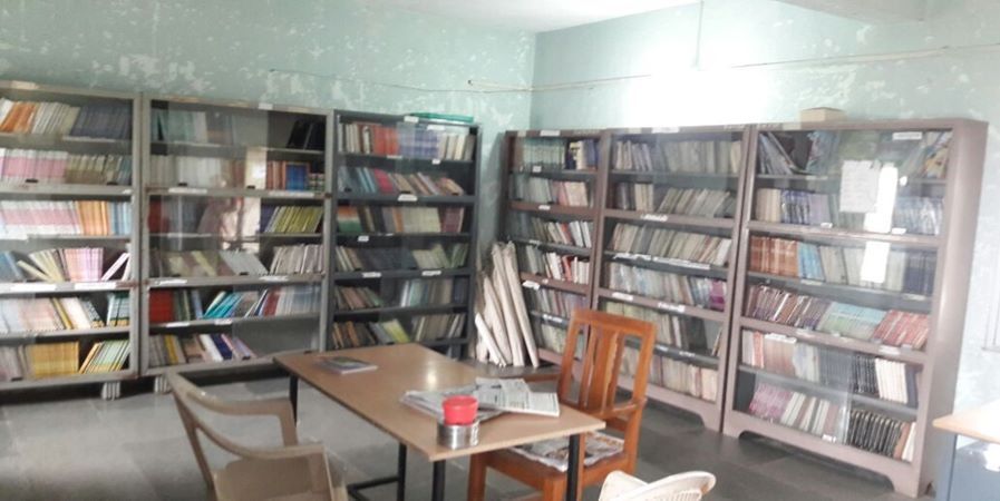Students reading books in a library